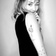 Illustration for article titled Miley Cyrus Joins Myspace in Spirit, Gets 'Rock n Roll' Heart Tattoo